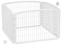 a white dog pen with a heart on it